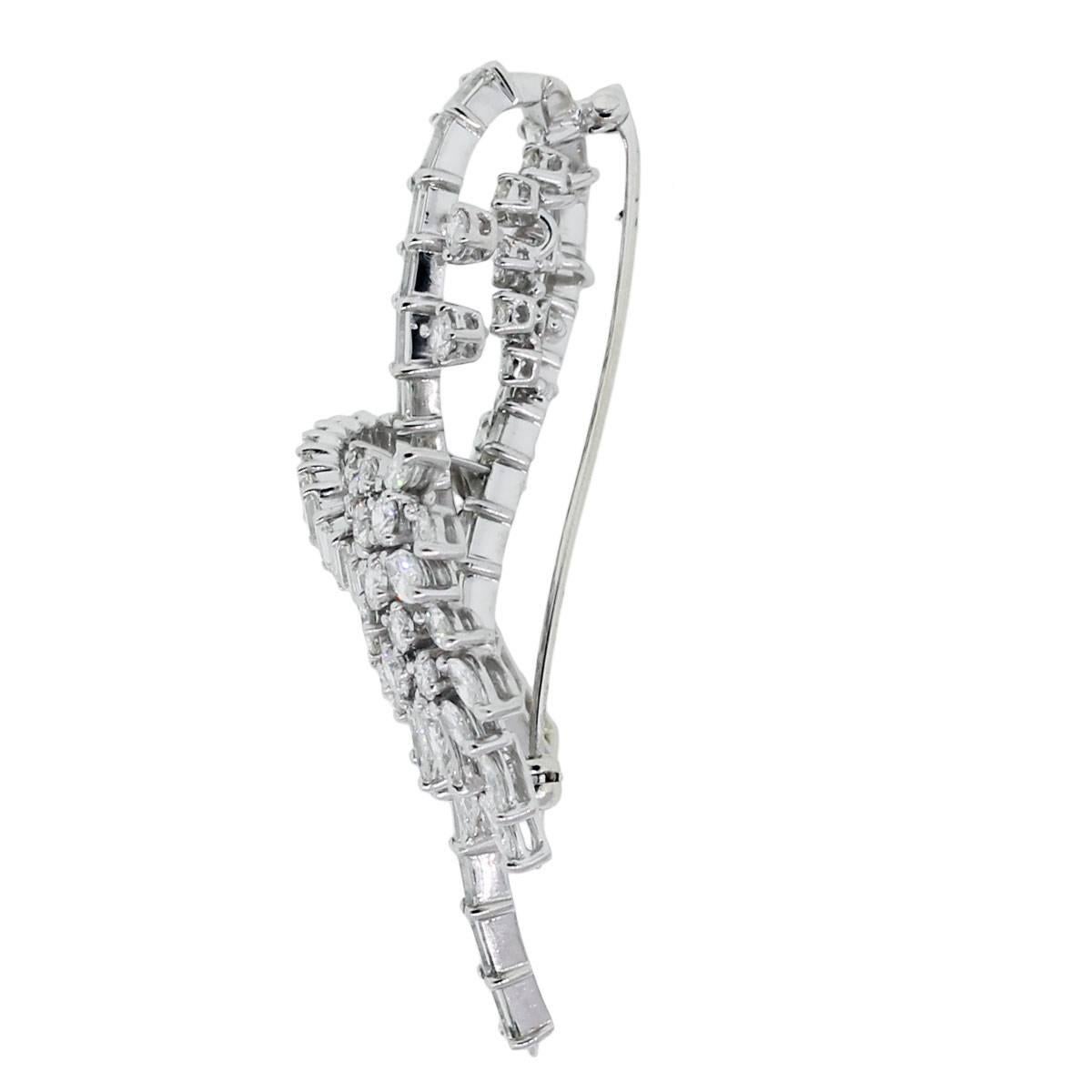 Style: Platinum 6ctw Diamond Vintage Brooch Pin
Material: Platinum
Diamond Details: Approximately 6ctw of of Baguette, Round Brilliant and Marquise Diamonds. Diamonds are F/G in color and VS in clarity.
Clasp: Pin stem & secure closure
Pin