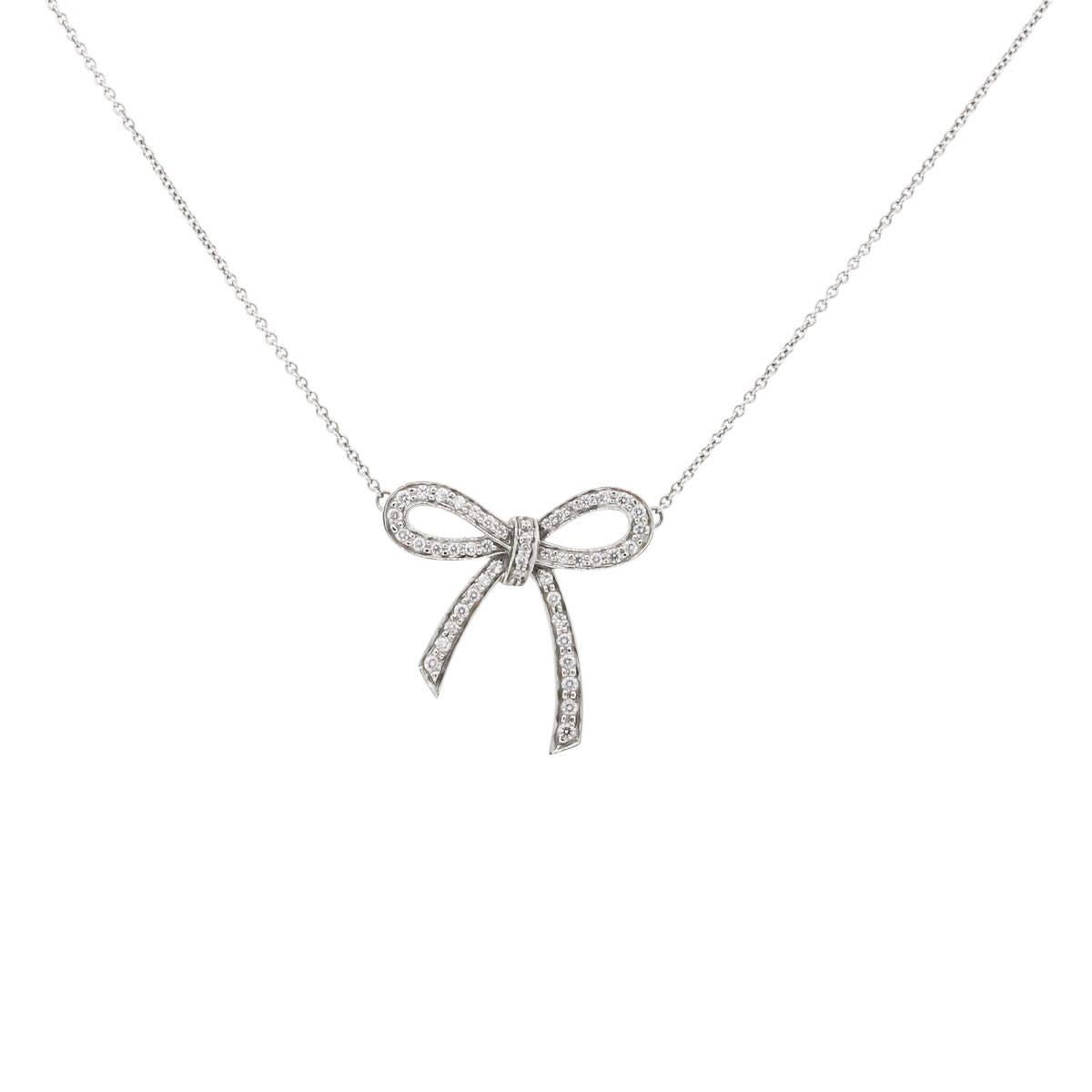 Style: Tiffany & Co. Platinum Diamond Bow Pendant Necklace
Length: Necklace is 16.25