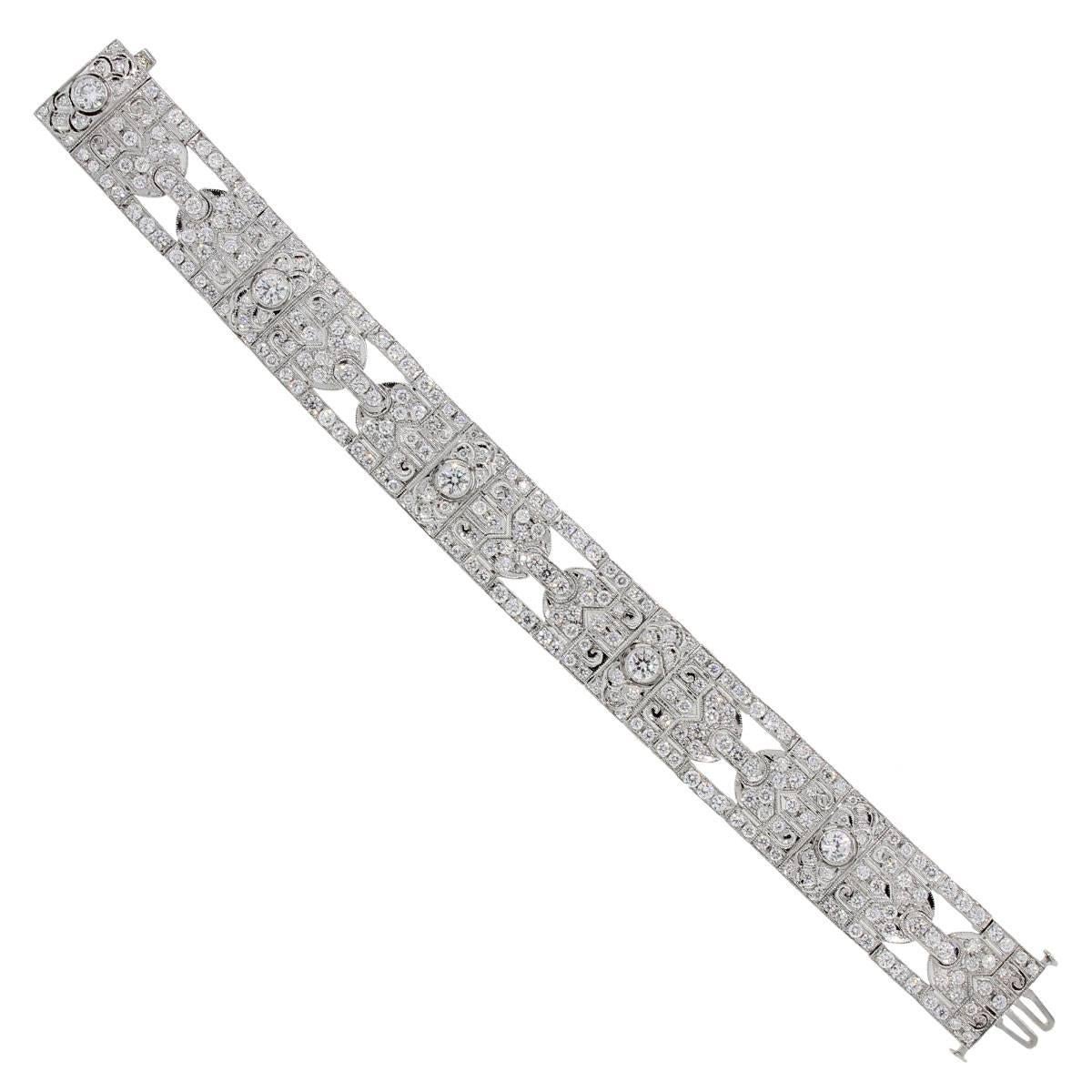 Style: Platinum 7.25ctw Diamond Deco Style Bracelet
Material: Platinum
Diamond Details: Approximately 7.25ctw of Round Brilliant Diamonds. Diamonds are G/H in color and VS in clarity.
Total Weight: 54.2g (34.9dwt)
Measurements: Fits a 7