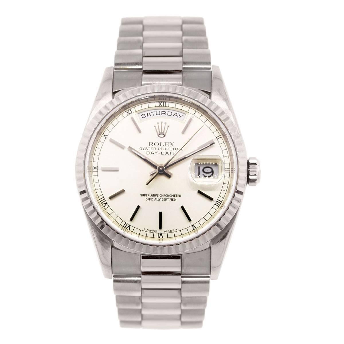 Brand: Rolex
MPN: 18239
Model: Day Date Presidential
Case Material: 18k White Gold
Case Diameter: 36mm
Bezel: 18k white gold fluted bezel
Dial: Silver dial with day and date window
Bracelet: 18k white gold presidential band
Size: Will fit a