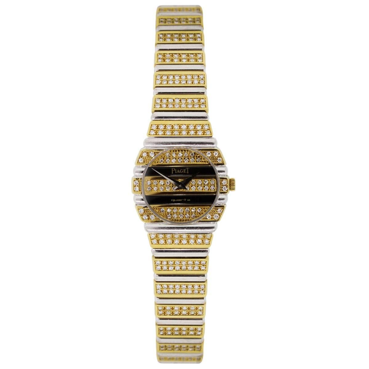 Brand: Piaget
MPN: 861C
Model: Polo
Case Material: 18k yellow gold
Case Diameter: 23.5mm
Bezel: 18k white and yellow gold with diamonds (factory)
Dial: 18k yellow gold with diamonds and black Onyx and silver hands. (factory)
Bracelet: 18k white and