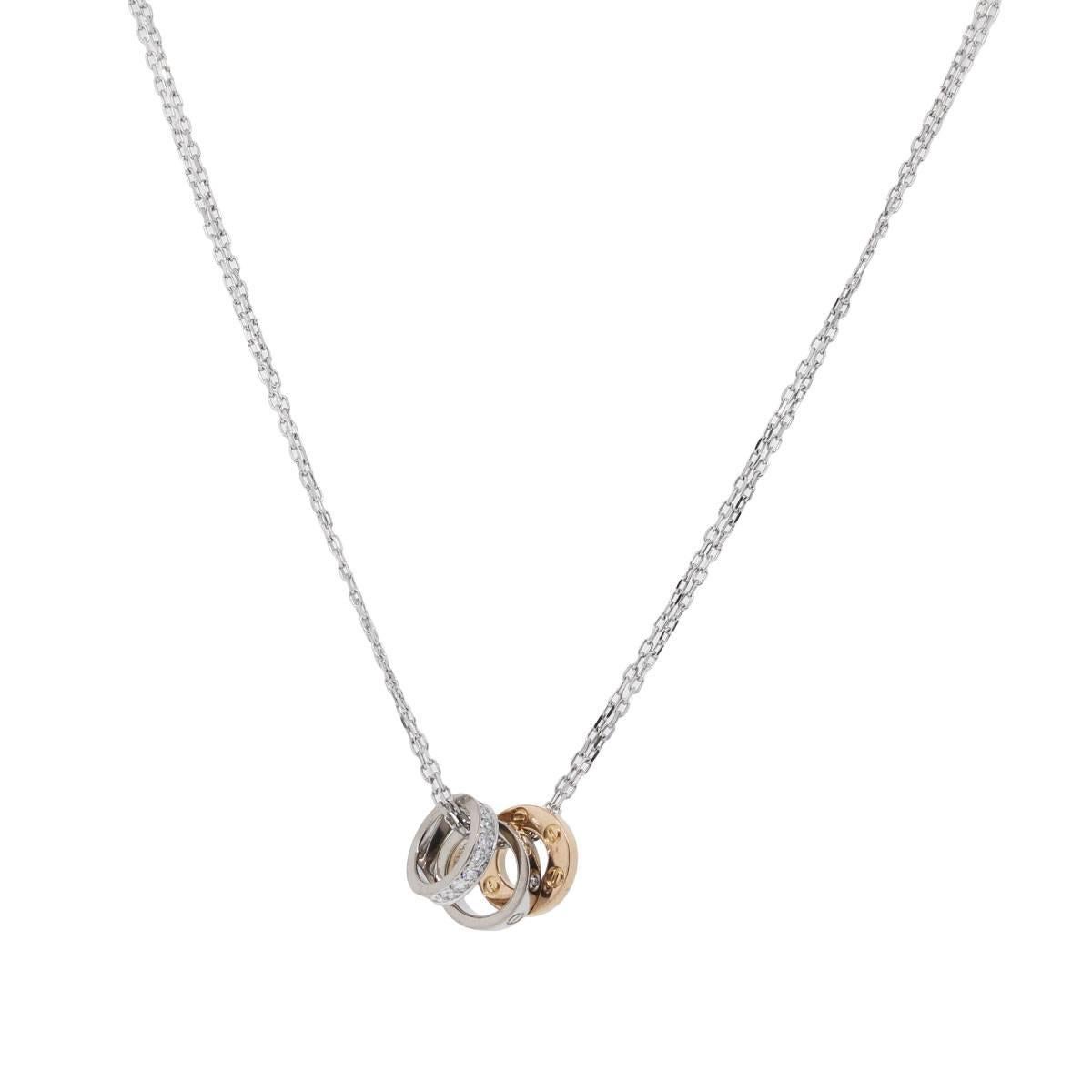 Designer: Cartier
Material: 18k white and rose gold
Diamond Details: Approximately 0.25ctw of round brilliant diamonds. Diamonds are E/F in Color and VS in Clarity
Necklace Length: 16