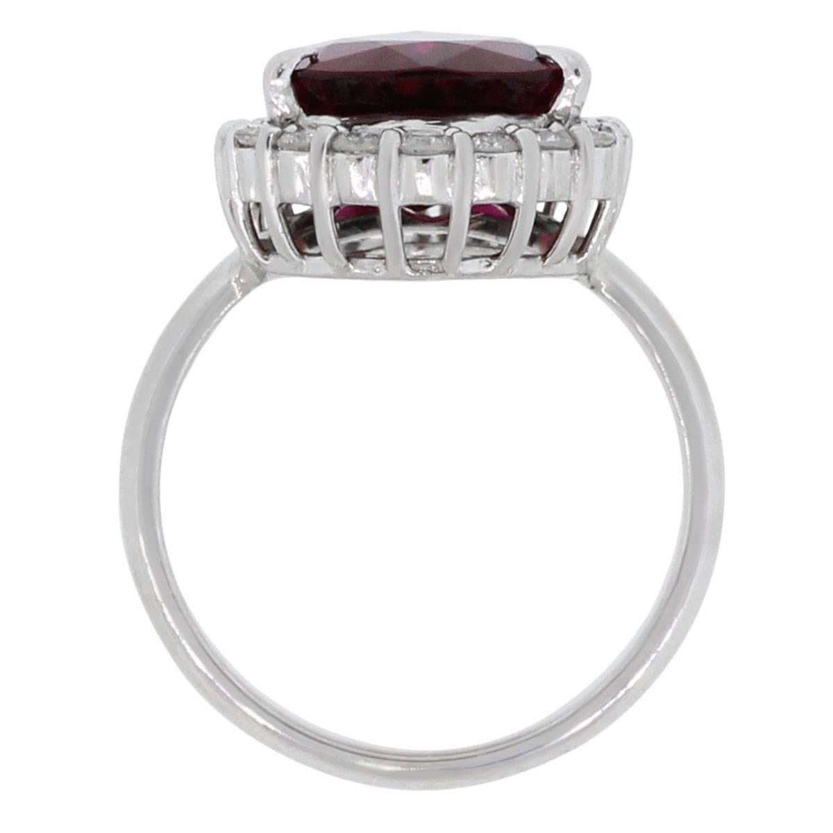 Material: Platinum
Diamond Details: Approximately 0.90ctw of Round Brilliant diamonds. Diamonds are G/H in color and VS in clarity.
Gemstone Details: Approximately 4.8ct Rubellite Center Stone measuring 13.80mm x 10.35mm
Ring Size: 5.5 (can be