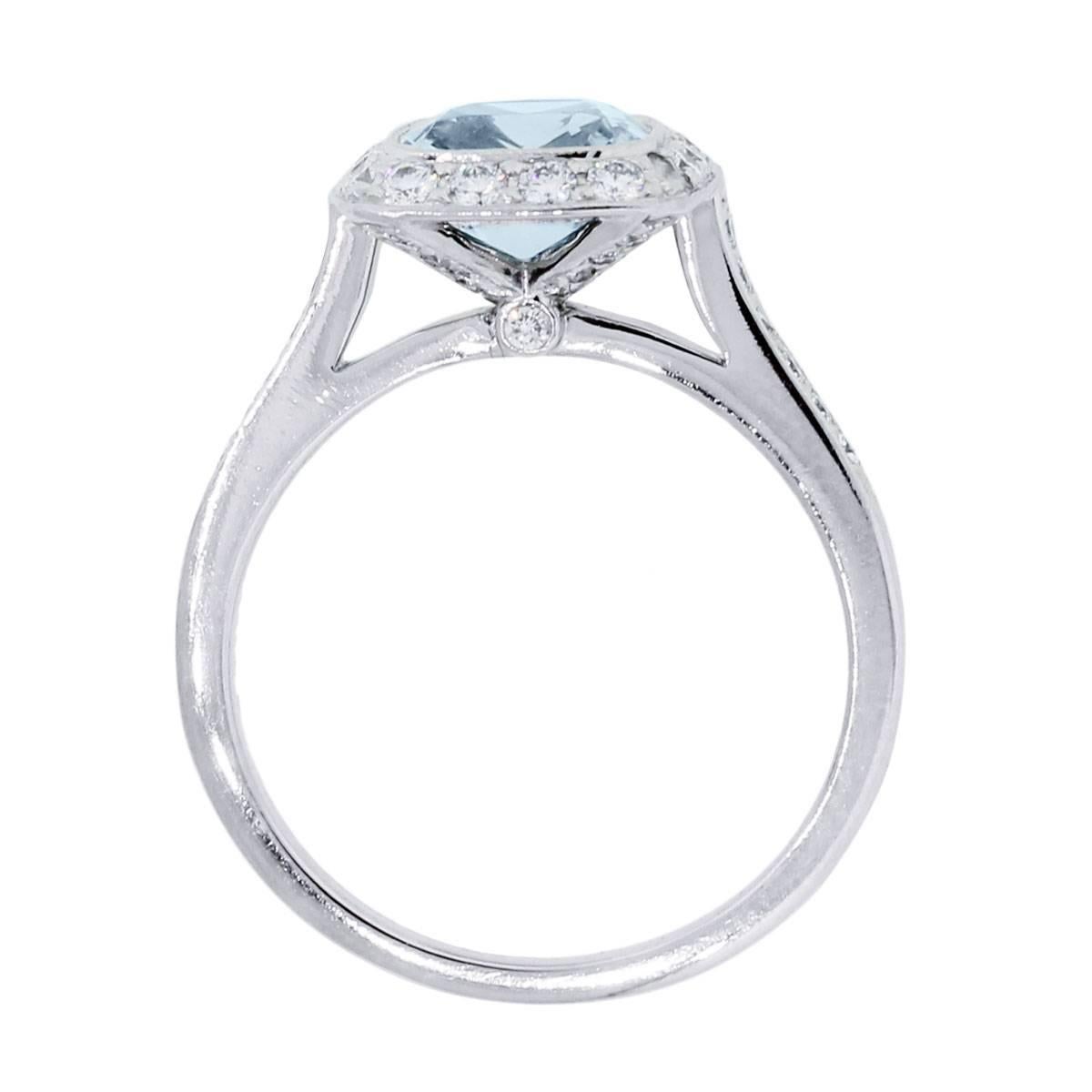 Designer: Tiffany & Co.
Material: Platinum
Diamond Details: 0.42ctw of round brilliant diamonds. Diamonds are F/G in color and VS1 in clarity
Gemstone Details: 1.63ct Cushion cut Aquamarine
Ring Size: 7.5 (can be sized)
Ring Measurements: 1.06