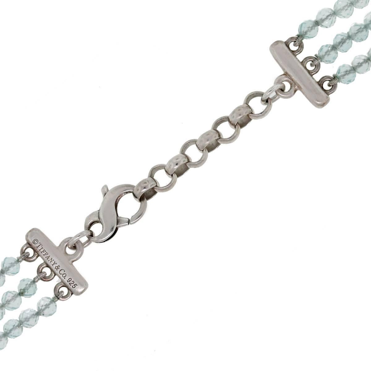 Designer:	Tiffany & Co.
Style: Faceted Bead Necklace
Material: Sterling Silver
Semi-Precious Gemstone: 3 Rows of 4.12mm Faceted Aquamarine Beads (Total 321)
Necklace Measurement: 	Adjustable from 17.5