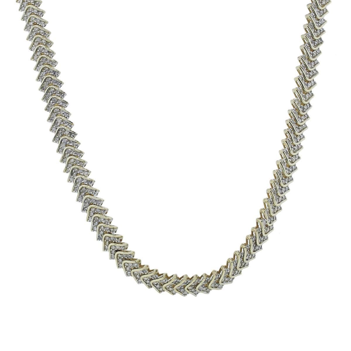 Style: 14k Yellow Gold 5.5ctw Diamond Chevron Necklace
Material: 14k Yellow Gold
Diamond Details: Approximately 5.5ctw of Round Brilliant Diamonds, H/I in color and SI in clarity
Total Weight: 81.3g (52.3dwt)
Necklace Length: 17.25
