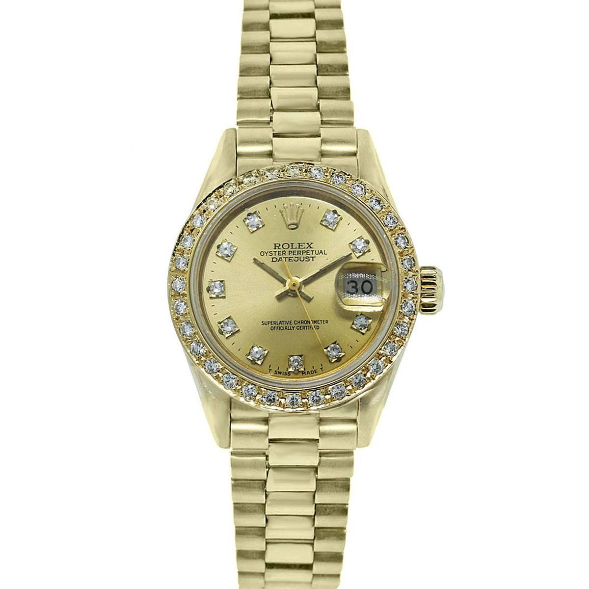 Brand: Rolex
Model: Datejust
Reference Number: 69178
Serial Number: 8 Mill
Case Measurements: 26mm
Case Material: 18k Yellow Gold
Dial: Gold with Diamond Markers. Diamonds are aftermarket.
Bezel: 18k Yellow Gold & Diamonds.  Diamonds are G in