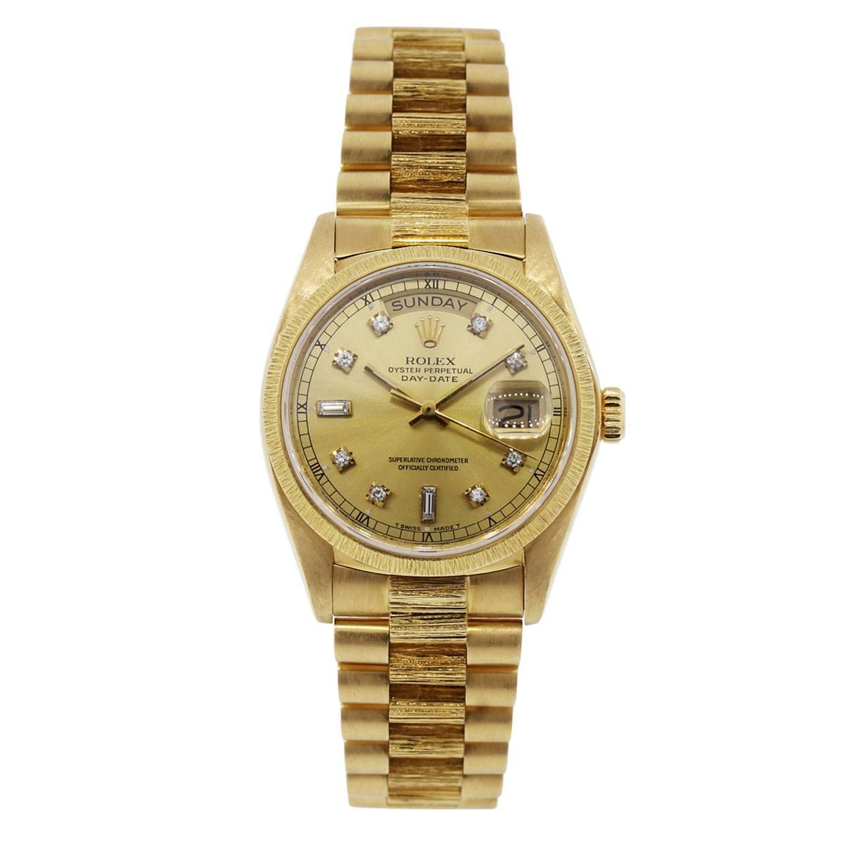 Brand: Rolex
Style: Rolex Day Date
MPN; 18078
Serial #: 6 mill
Case Material: 18k Yellow Gold
Case Diameter: 36mm
Bezel: 18k Yellow Gold fixed Bark bezel
Dial: Champagne Diamond Dial with gold hands and diamond hour markers
Bracelet: 18k Yellow Gold