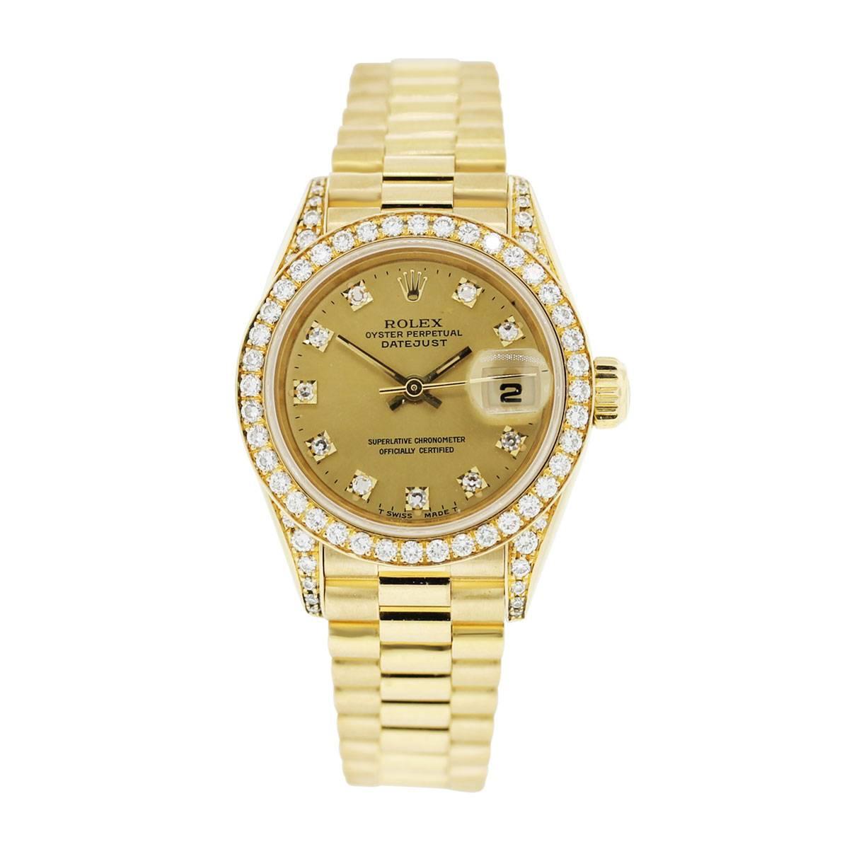 Brand: Rolex
Model: Datejust
Reference Number: 69158
Serial: S
Material: 18k Yellow Gold
Dial: Gold Dial with 10 Round Brilliant Diamond Dial Markers, Date at 3 o'clock (factory original)
Diamond details: Fixed bezel , 18k Yellow Gold Bezel with