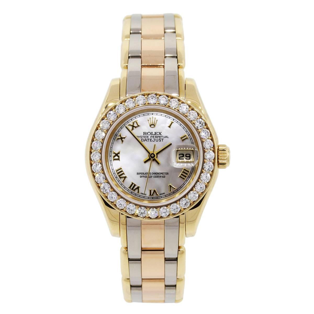 Brand: Rolex
MPN: 69298
Serial: "W"
Style: Datejust Tridor Pearlmaster
Material: 18k White Gold, 18k Rose Gold, 18k Yellow Gold
Dial: Mother of pearl roman dial with yellow gold roman numeral hour markers and date window at the 3