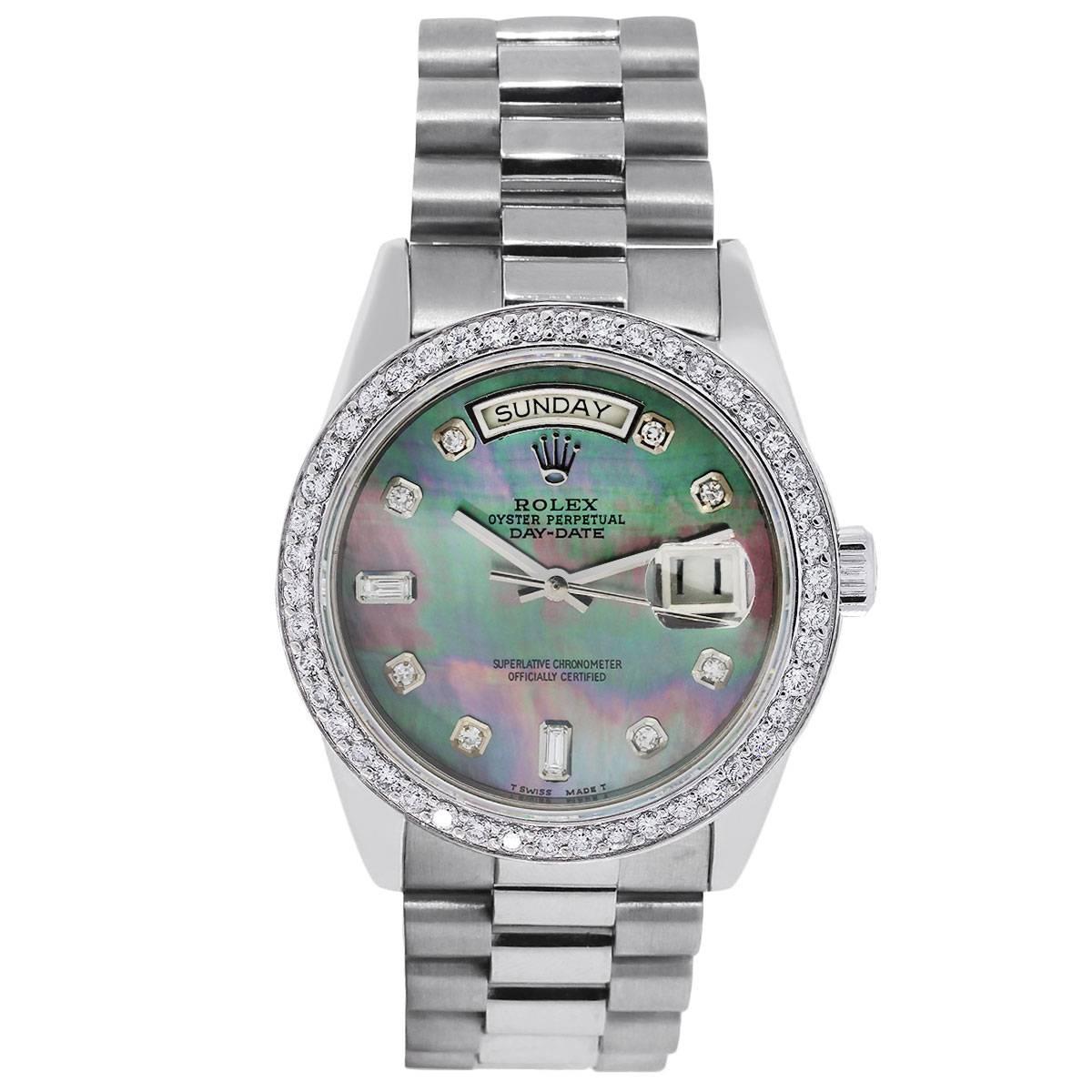 Brand: Rolex
MPN: 18039 
Model: Day-Date presidential
Case Material: 18k White Gold
Case Diameter: 34mm
Crystal: Scratch resistant sapphire
Bezel: 18k white gold diamond bezel
Dial: Tahitian mother of pearl dial with diamond hour markers. Day