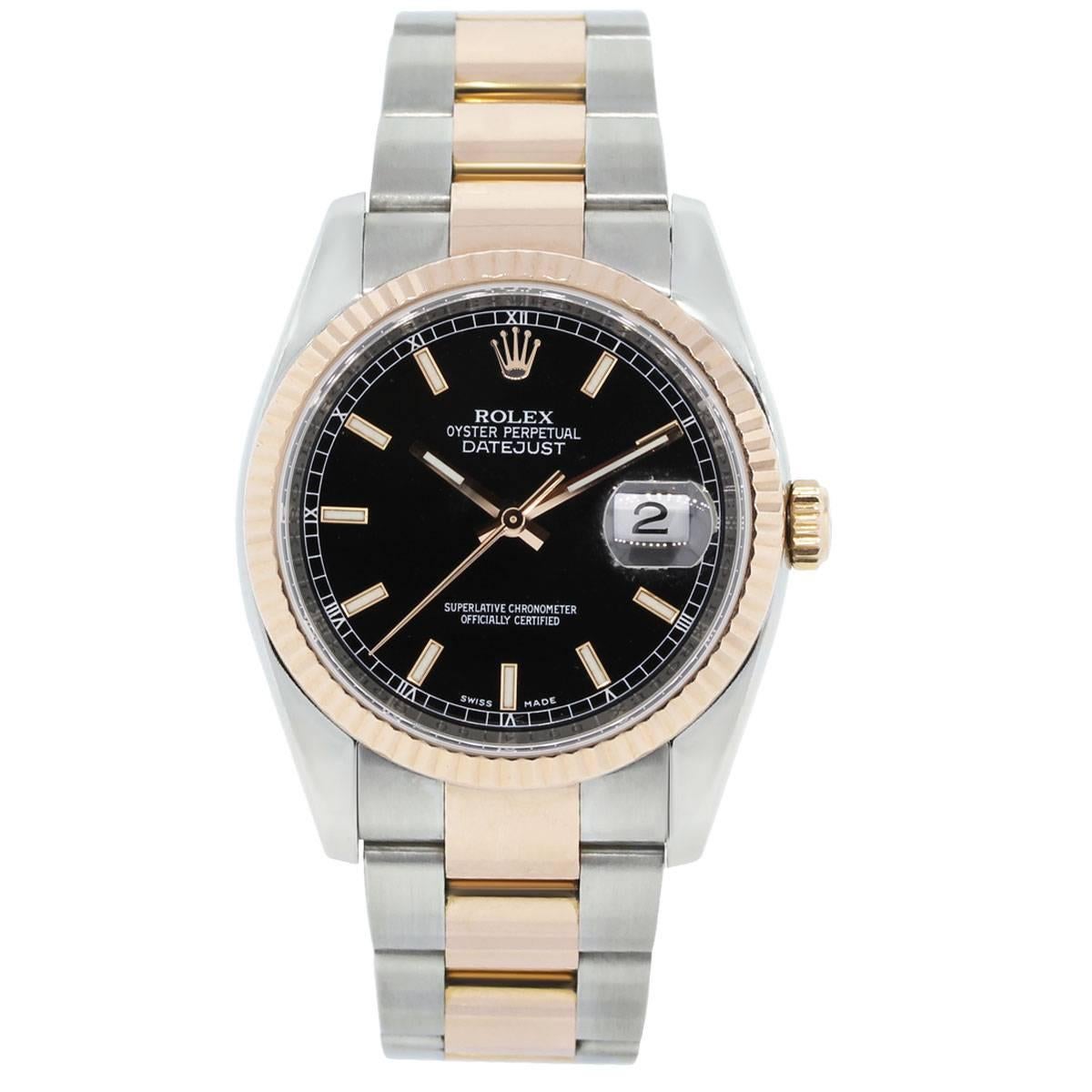Brand: Rolex
MPN: 116231
Model: Datejust
Case Material: stainless steel
Case Diameter: 36mm
Crystal: Sapphire crystal
Bezel: 18k rose gold fluted bezel
Dial: Black dial with rose gold outlined luminescent hour markers, rose gold hands and date