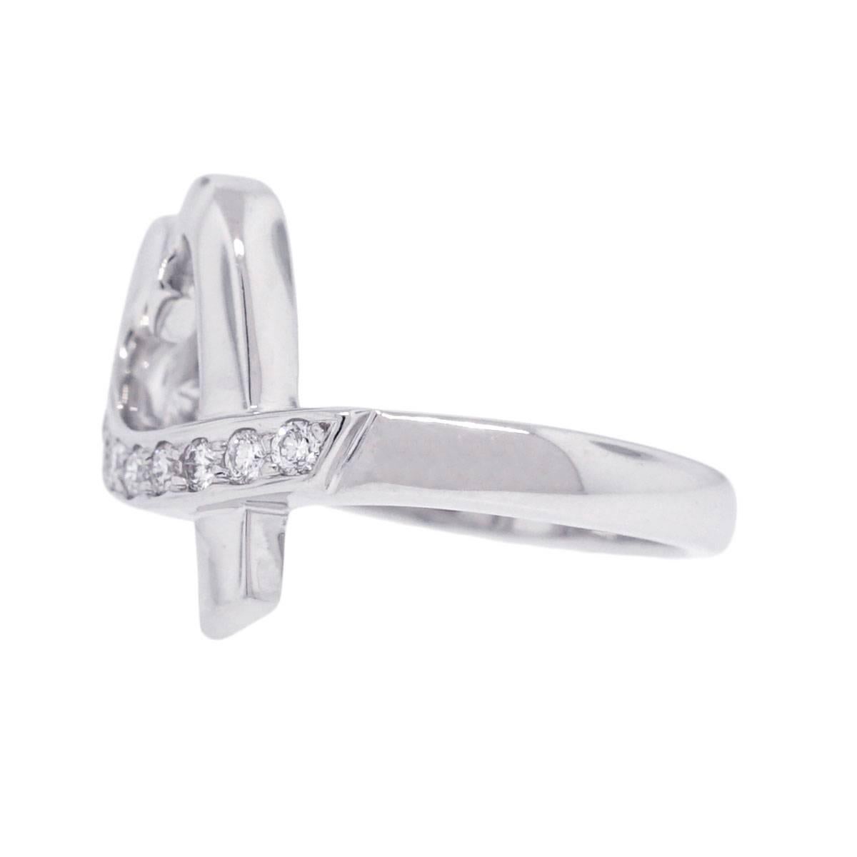 Brand: Tiffany & Co.
Style: Paloma Picasso White Gold Diamond Loving Heart Ring
Material: 18k White Gold
Diamond Details: Approximately 0.20ctw round brilliant diamonds. Diamonds are G/H in color and VS in clarity.
Ring Size: Size 5.5
Total Weight: