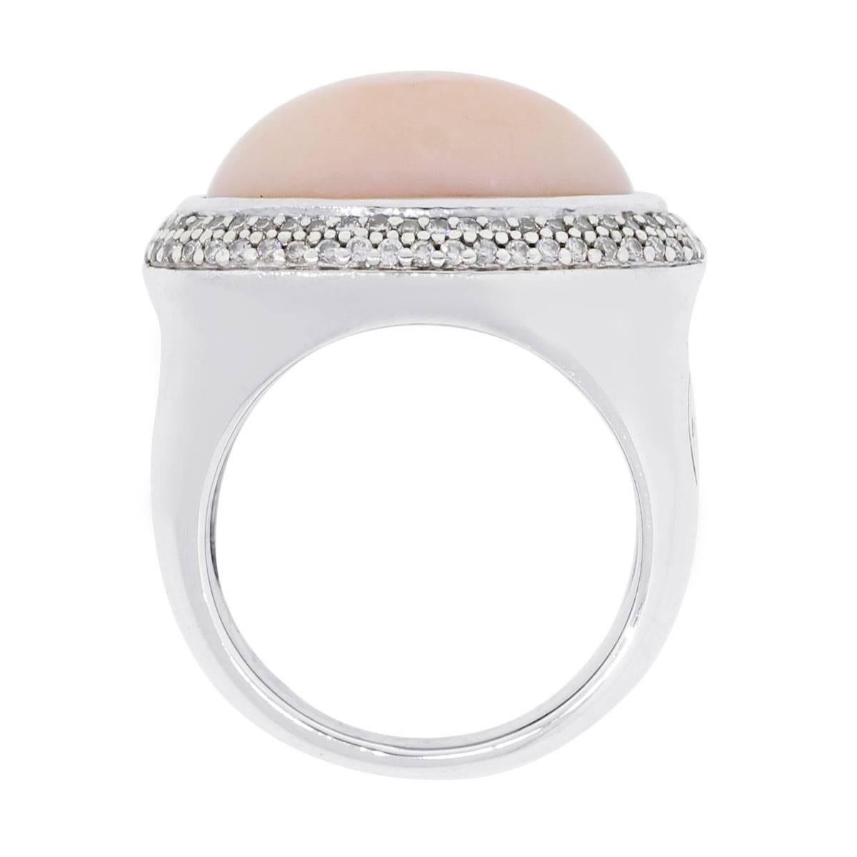 Designer: David Yurman
Material: Sterling silver
Diamond Details: Round brilliant diamonds
Gemstone Details: Oval shape Peach Moonstone measuring approximately 17.27mm x 12.261mm
Ring Size: 6.75
Ring Measurements: 1.12