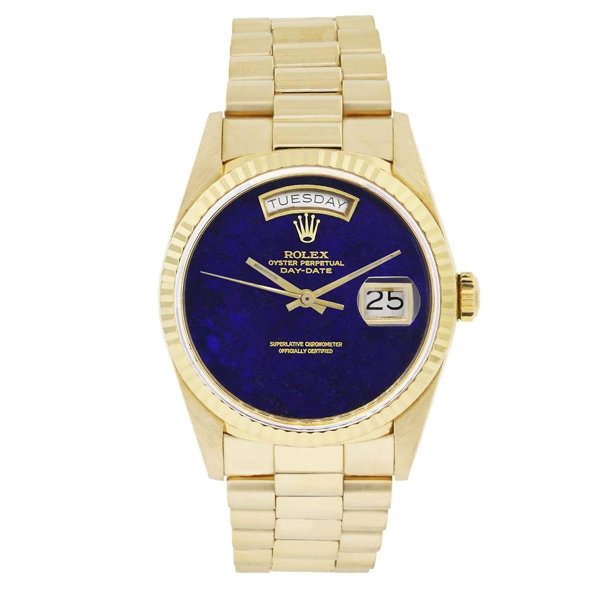 Brand: Rolex
MPN: 18038 
Model:  Day-Date
Case Material: 18k Yellow Gold
Case Diameter: 36mm
Crystal: Sapphire crystal
Bezel: 18k yellow gold fluted fixed bezel
Dial: Lapis lazuli dial with Date is displaced at 3 o'clock. Day is displayed at 12