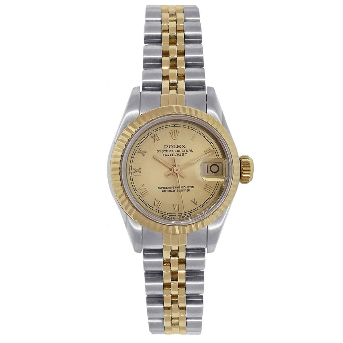 Brand:  Rolex
MPN: 69173
Model: Datejust
Case Material: Stainless steel
Case Diameter: 26mm
Crystal: Sapphire crystal
Bezel: 18k yellow gold fluted bezel
Dial: Champagne dial with yellow gold roman numeral hour markers and yellow gold hour and