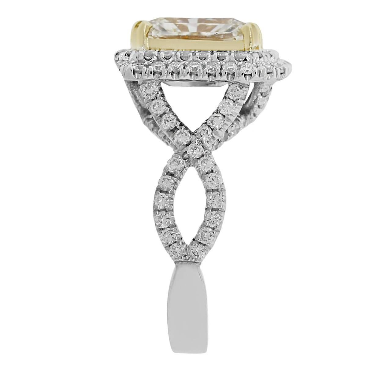 Material: 18k yellow and white gold
Style: Fancy yellow diamond ring
Center Diamond Details: Approximately 3.01ct radiant cut fancy yellow diamond.
Diamond Details: Approximately 1.58ctw accent round brilliant cut diamonds. Diamonds are G/H in color