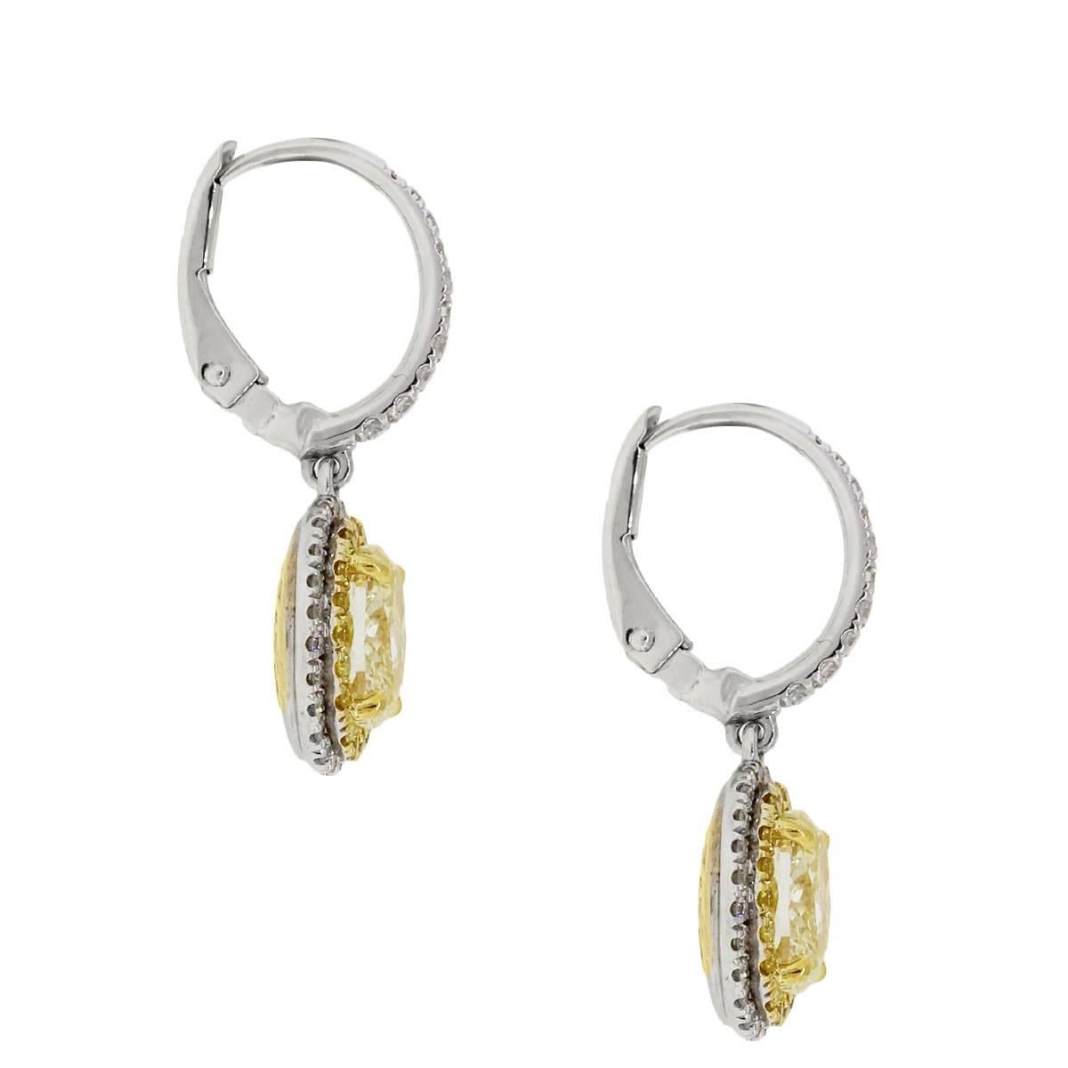 Material: 18k white and yellow gold
Style: Drop dangle earrings
Diamond Details: Approximately 2.01ctw of oval shape fancy yellow diamonds. Approximately 0.45ctw of round brilliant diamonds.
Earring Measurements: 1" x 0.42" x