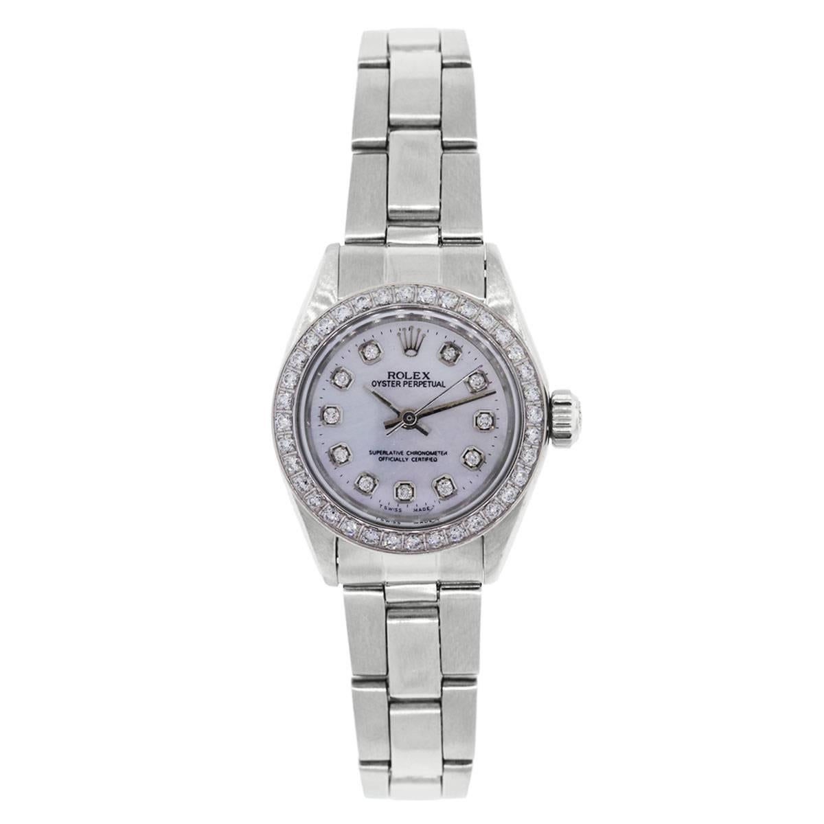 Rolex: 6718 Oyster Perpetual MOP Diamond Dial and Bezel Ladies Watch
Brand: Rolex
MPN: 6718
Model: Oyster Perpetual
Case Material: Stainless Steel
Case Diameter: 26mm
Crystal: Sapphire (scratch resistant)
Bezel: Diamond bezel (aftermarket)
Dial: