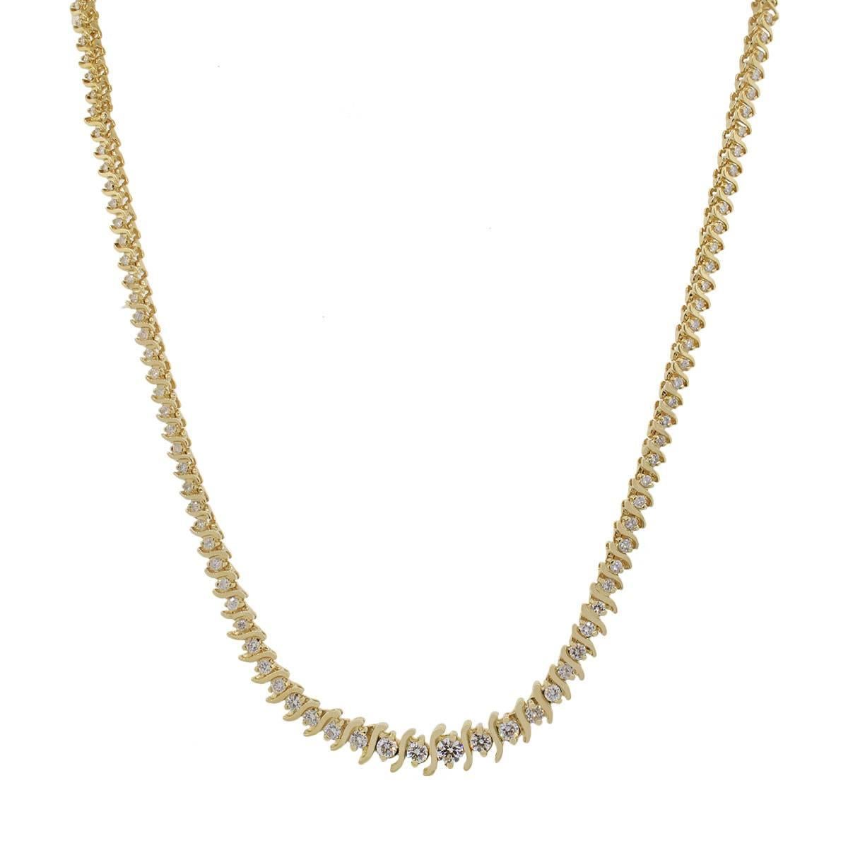 Material: 18k yellow gold
Style: Graduated Diamond Tennis Necklace
Diamond Details: Approximately 3.60ctw of round brilliant diamonds. Diamonds are H/I in color and SI in clarity.
Measurements: Necklace is 17" in length
Clasp: Tongue in box
