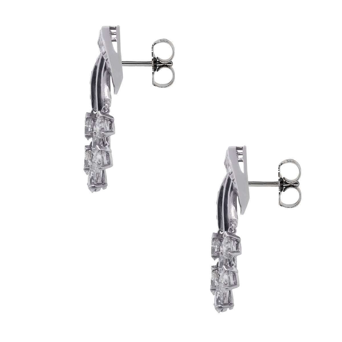 Material: Platinum
Diamond Details: Approximately 5.50ctw of baguette and pear shape diamonds. Diamonds are G/H in color and VS in clarity.
Measurements: 0.57" x 0.54" x 1.20"
Earring Backs: Post friction backs
Total Weight: 14.0g