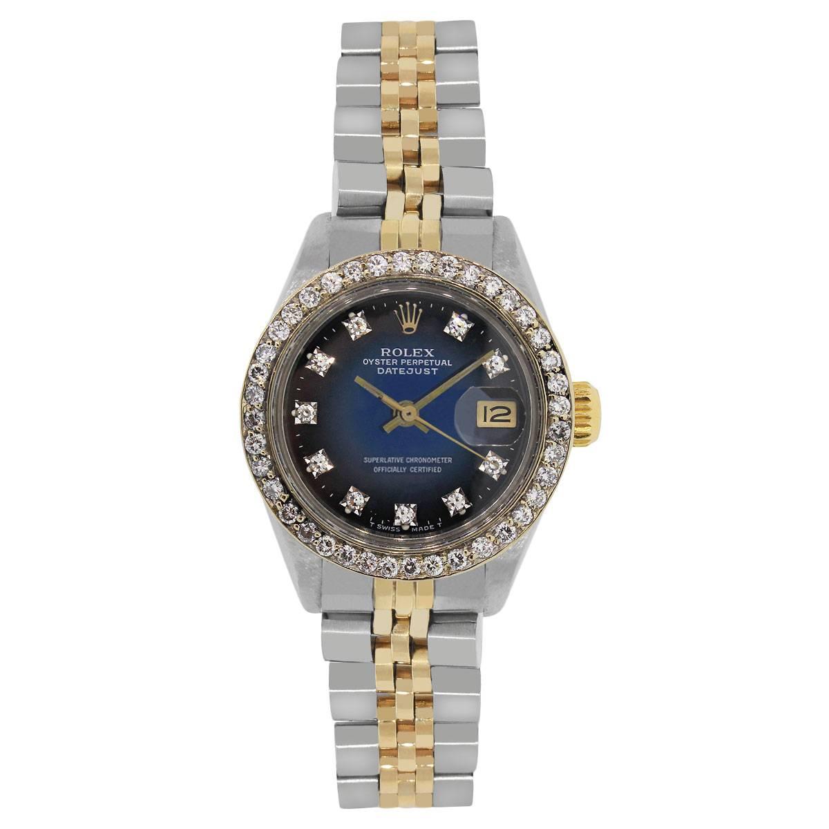 Brand: Rolex
MPN: 6917
Model: Datejust
Case Material: Stainless steel
Case Diameter: 26mm
Crystal: Acrylic
Bezel: Stainless Steel diamond bezel
Dial: Blue gradient dial with diamond hour markers (aftermarket) Yellow gold hour and minute hands. Date