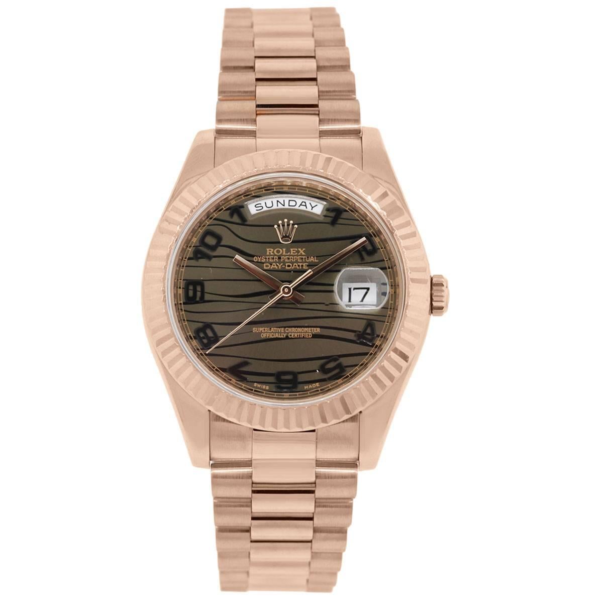 Brand: Rolex
Model: Day-Date II
MPN: 218235
Serial: "G"
Case Material: 18k Rose Gold
Case Diameter: 41 mm
Bezel: 18k rose gold fluted bezel
Dial: Bronze wave dial with day and date window
Movement: Automatic
Size: Will fit a 7.5"