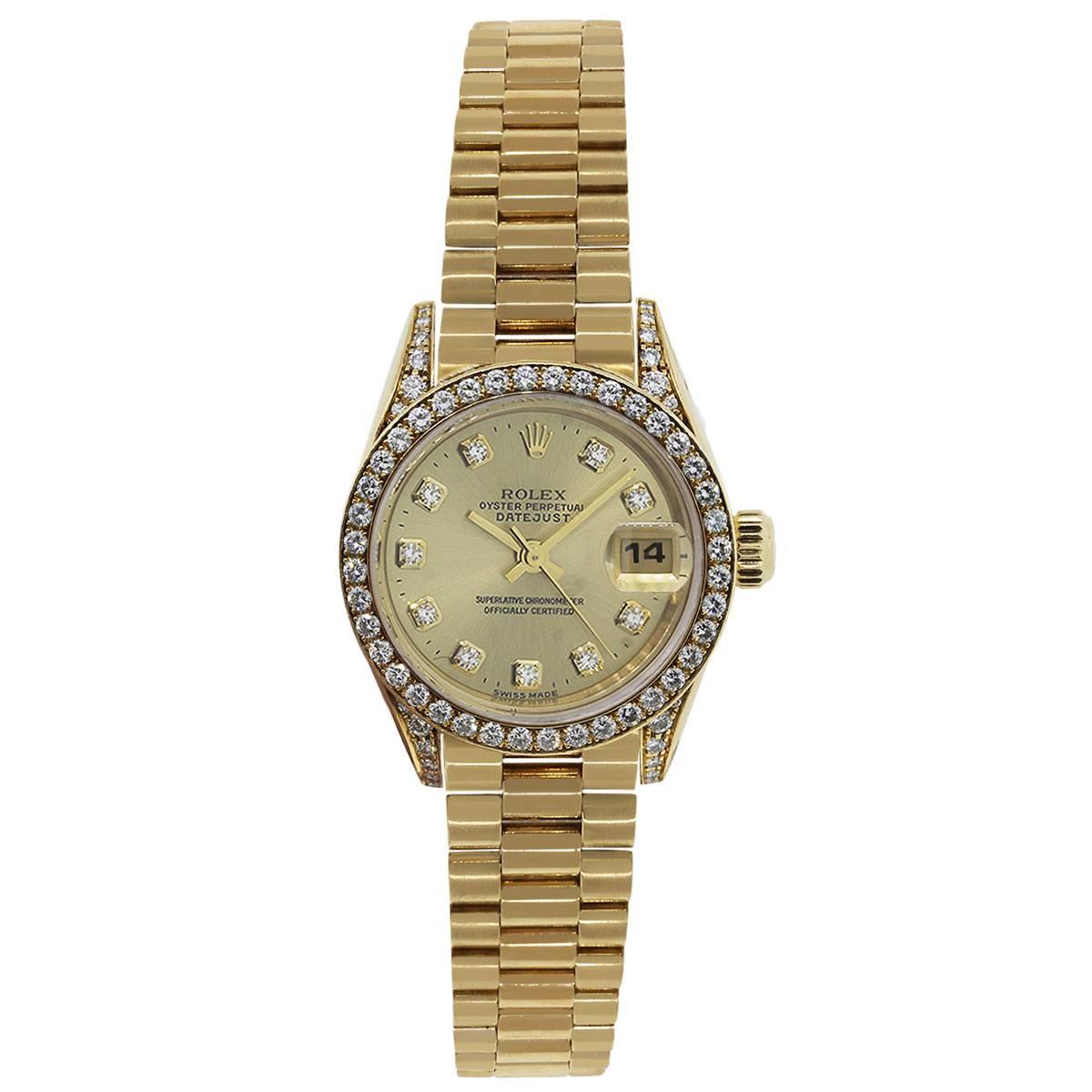 Brand: Rolex
MPN: Datejust
Model: 69158
Case Material: 18k Yellow Gold
Case Diameter: 26mm
Crystal: Original Rolex Sapphire Crystal
Bezel: 18k yellow gold diamond bezel (factory) Diamonds are G in color and VS in clarity. Diamonds extend onto case