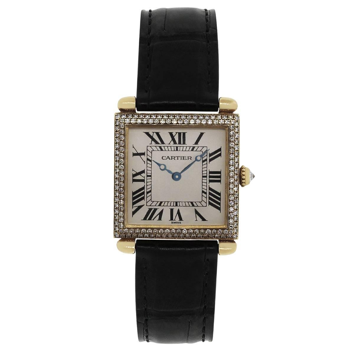 Brand: Cartier
MPN: 1630
Model: Tank Obus
Case Material: 18k Yellow Gold
Case Diameter: 24mm
Crystal: Scratch resistant sapphire
Bezel: 18k yellow gold diamond bezel (factory)
Dial: Off white dial with black roman numerals with blue hour and minute