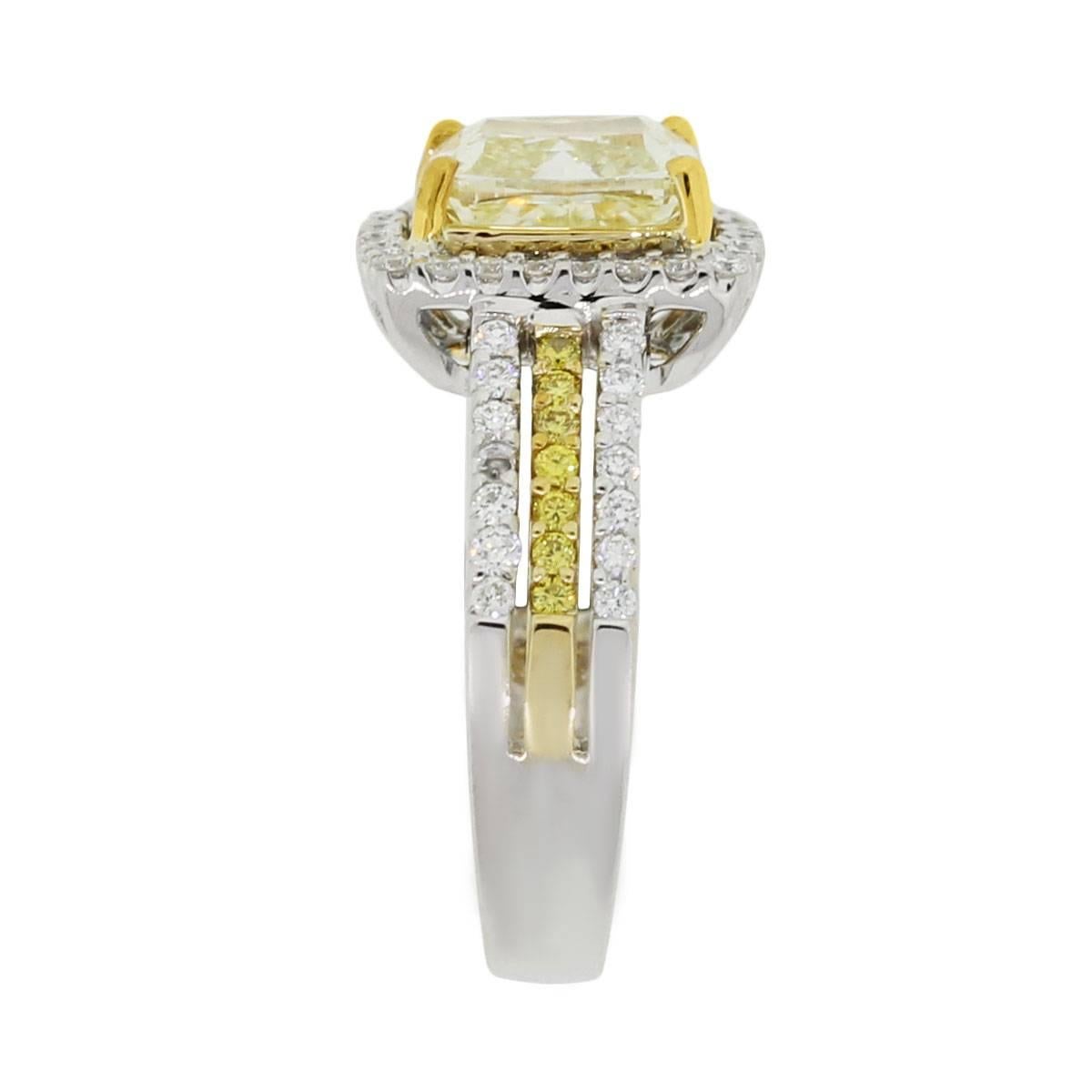 Material: 18k white gold with yellow gold prongs
Center Diamond Details: Cushion cut fancy yellow diamond approximately 2.03ct. Diamond is yellow in color and SI in clarity
Diamond Details: Approximately 1ctw total of round brilliant fancy yellow