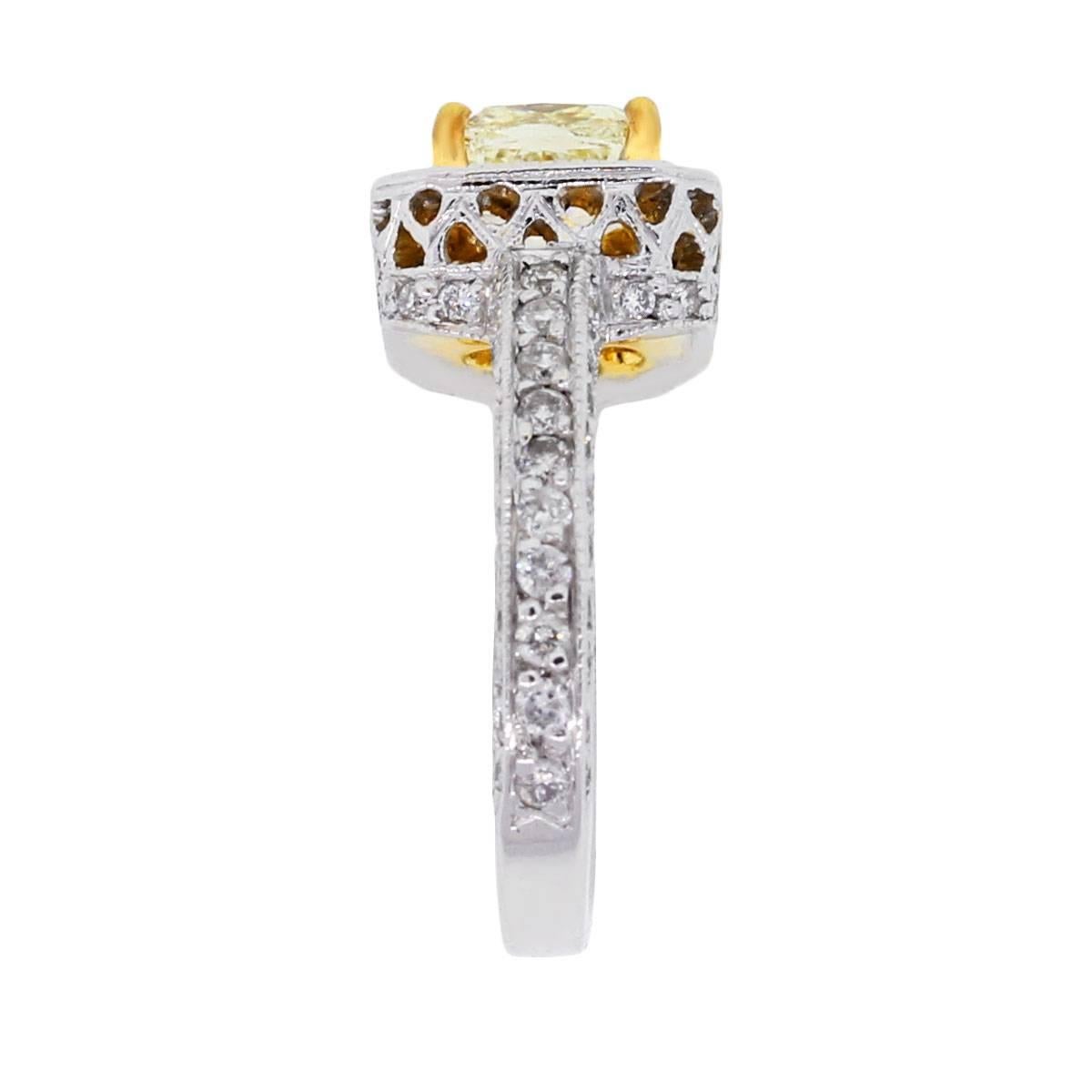 Material: 18k white and yellow gold
Center Diamond Details: Approximately 1.61ct fancy yellow cushion cut diamond. Diamond is yellow in color and SI1 in clarity
Diamond Details: Approximately 1ctw of round brilliant diamonds. Diamonds are G/H in