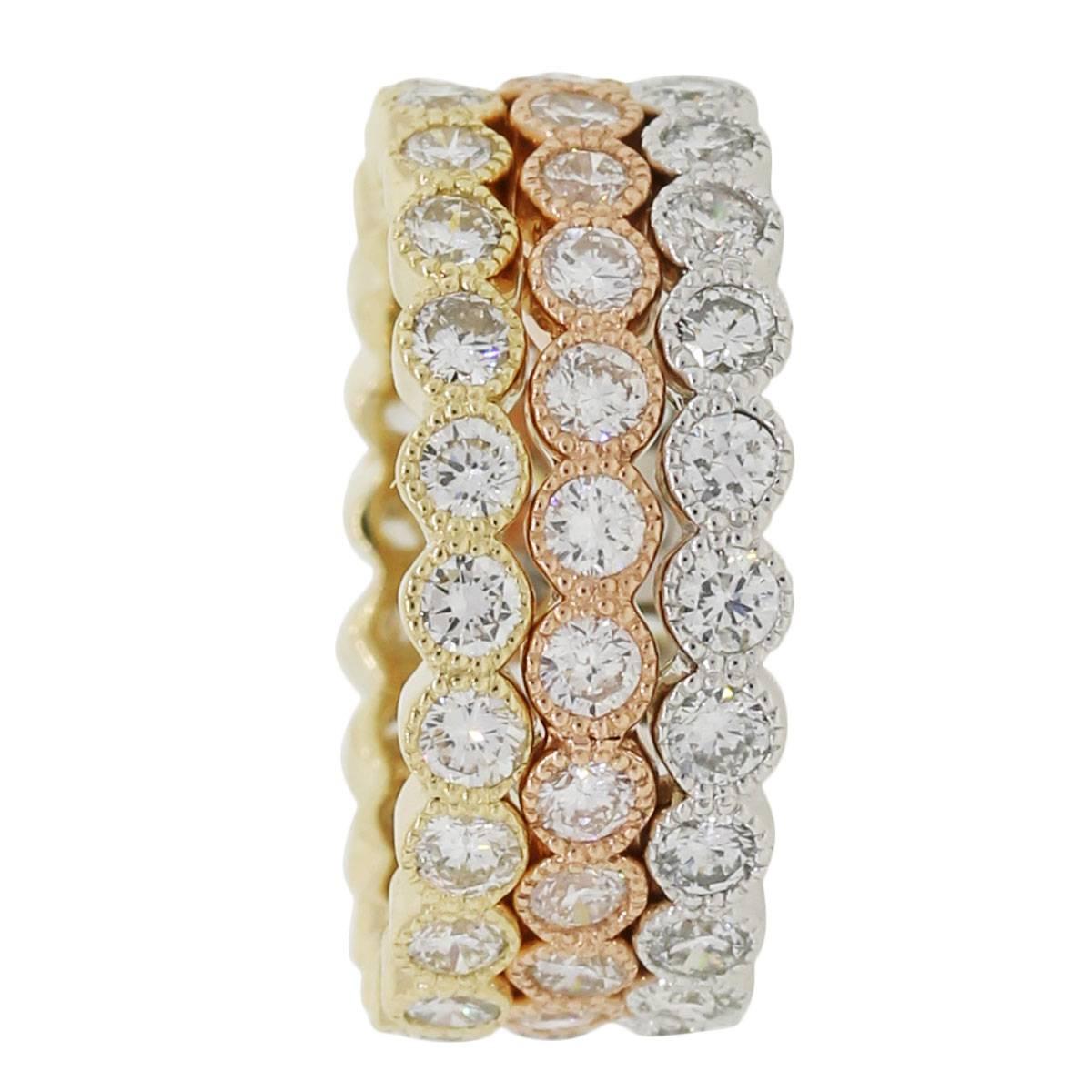 Material: 14k white gold, yellow gold, rose gold
Diamond Details: Approximately 3.05ctw of round brilliant diamonds. Diamonds are G/H in color and SI in clarity
Ring Size: 5.75
Ring Measurements: Each band measures 0.82″ x 0.11″ x 0.82″
Total
