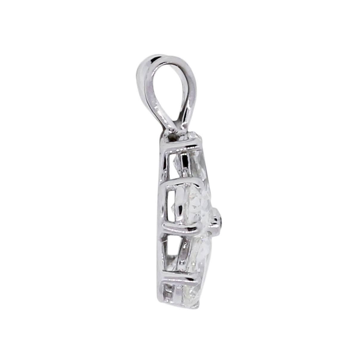 Material: 14k white gold
Diamond Details: Approximately 0.99ctw of pear shape and round brilliant diamonds. Diamonds are G/H in color and SI in clarity
Pendant Dimensions: 0.64″ x 0.20″ x 0.46″
Total Weight: 1g (0.6dwt)
Additional Details: Comes