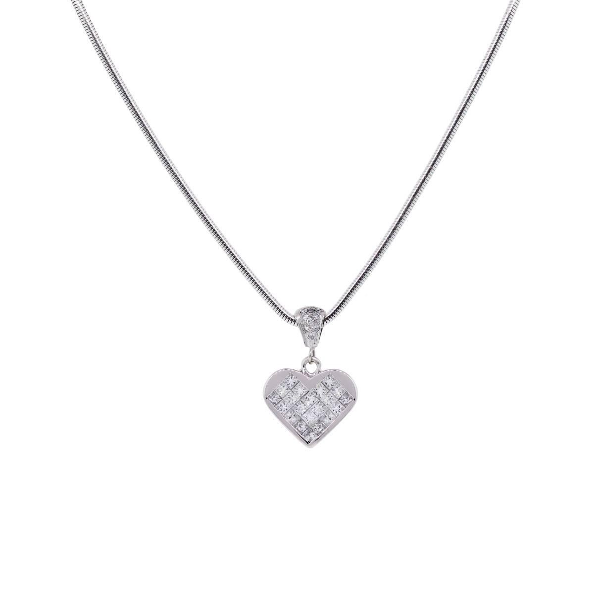 Material: 18k white gold
Diamond Details: 1.70ctw of invisible set princess cut diamonds and round brilliant diamonds. Diamonds are G in color and VS in clarity.
Necklace Measurements: 14k white gold snake chain is 18″ in length
Pendant Dimensions: