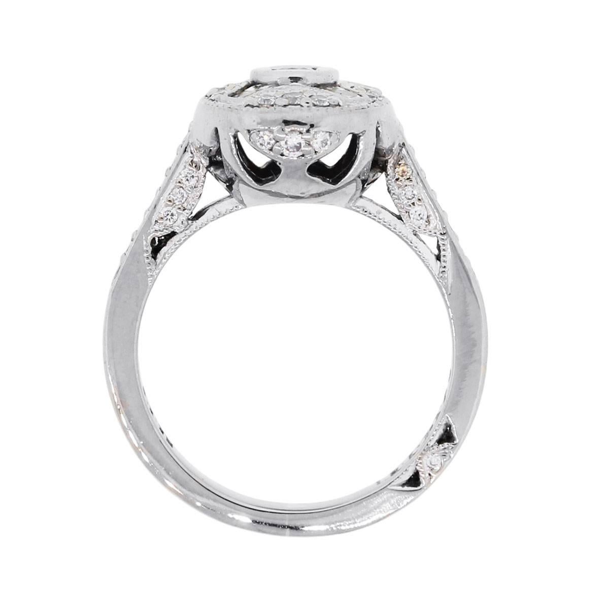 Designer: Tacori
Material: 18k white gold
Diamond Details: Approximately 0.50ctw of round brilliant and baguette shape diamonds. Diamonds are G in color and VS in clarity
Ring Size: 6 (can be sized)
Ring Measurements: 1″ x 0.43″ x 0.81″
Total