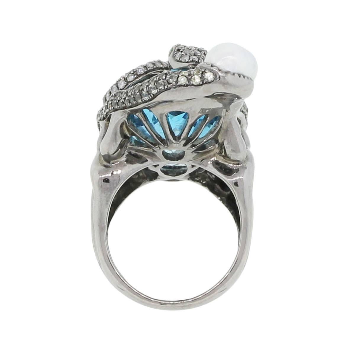 Material: Black rhodium 18k white gold
Diamond Details: Approximately 3ctw of round brilliant diamonds. Diamonds are G/H in color and SI in clarity
Gemstone Details: Oval shape aquamarine stone measuring approximately 1.50″ x 0.75″. Round shape