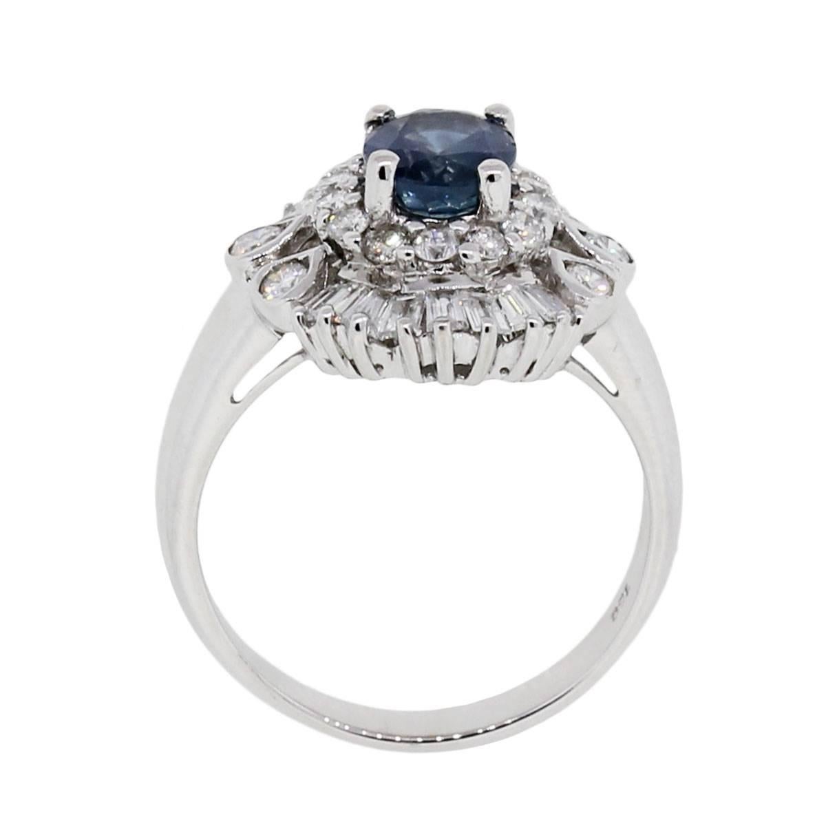 Material: 18k white gold
Diamond Details: Approximately 1.5ctw of baguette shape diamonds and round brilliant diamonds. Diamonds are G/H in color and SI in clarity
Gemstone Details: Oval shape Sapphire measuring approximately 7.61mm x 5.98mm
Ring