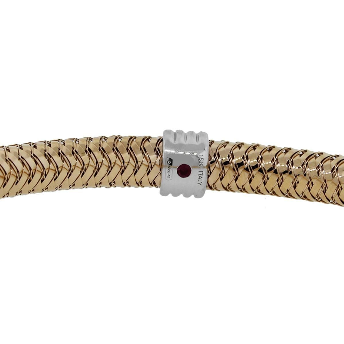 Brand: Roberto Coin
Style: 4 Station bangle
Material: 18k rose gold and white gold
Total Weight: 16.2g (10.4dwt)
Bracelet Length: 6.5″
Clasp: No clasp. Flexible bangle
Additional Details: This item comes with a Raymond Lee Jewelers presentation