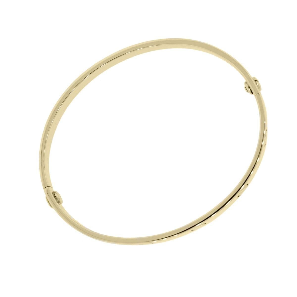 Brand: Cartier
Style: Love Bangle
Metal: 18k Yellow Gold
Bracelet Size: Cartier size 17 (will fit a 6.25″ wrist)
Total Weight: 27.2g (17.5dwt)
Closure: (2) Screw Closure
Additional Details: Comes with Raymond Lee Jewelers Presentation Box and