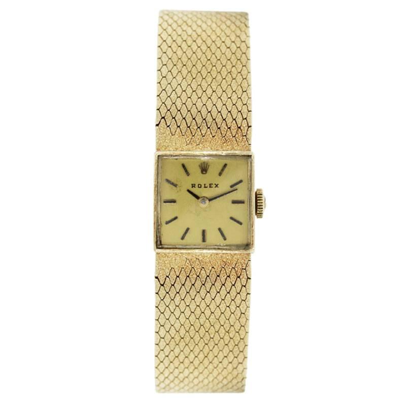 Brand: Rolex
Case Material: 14k yellow gold
Case Diameter: 17mm x 17mm
Crystal: Plastic
Bezel: Smooth 14k yellow gold
Dial: Gold tone stick dial
Bracelet: 14k yellow gold mesh bracelet
Size: Will fit a 6.25″ wrist
Clasp: 14k yellow gold jeweler’s