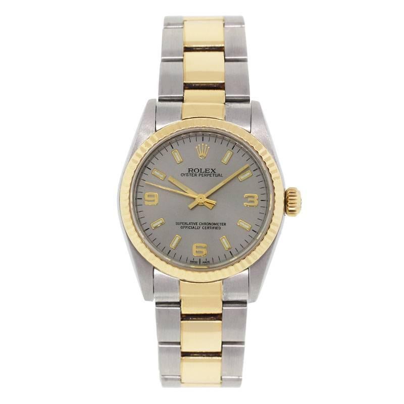 Brand: Rolex
MPN: 77513
Model: Midsize Oyster Perpetual
Case Material: Stainless steel
Case Diameter: 31mm
Crystal: Scratch resistant sapphire
Bezel: 18k yellow gold fluted bezel
Dial: Silvered stick dial with gold hour markers
Bracelet: Two tone