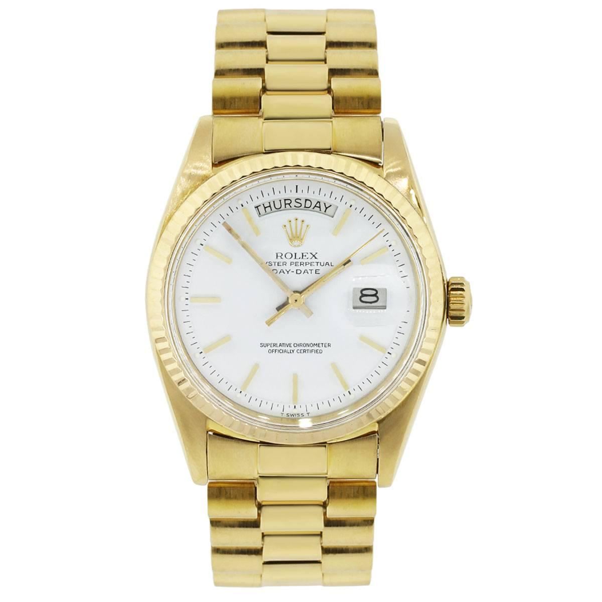 Brand: Rolex
MPN: 1803
Model: Day Date
Case Material: 18k yellow gold
Case Diameter: 36mm
Crystal: Scratch resistant sapphire
Bezel: 18k yellow gold fluted bezel
Dial: White stick dial with day and date window
Bracelet: 18k yellow gold presidential