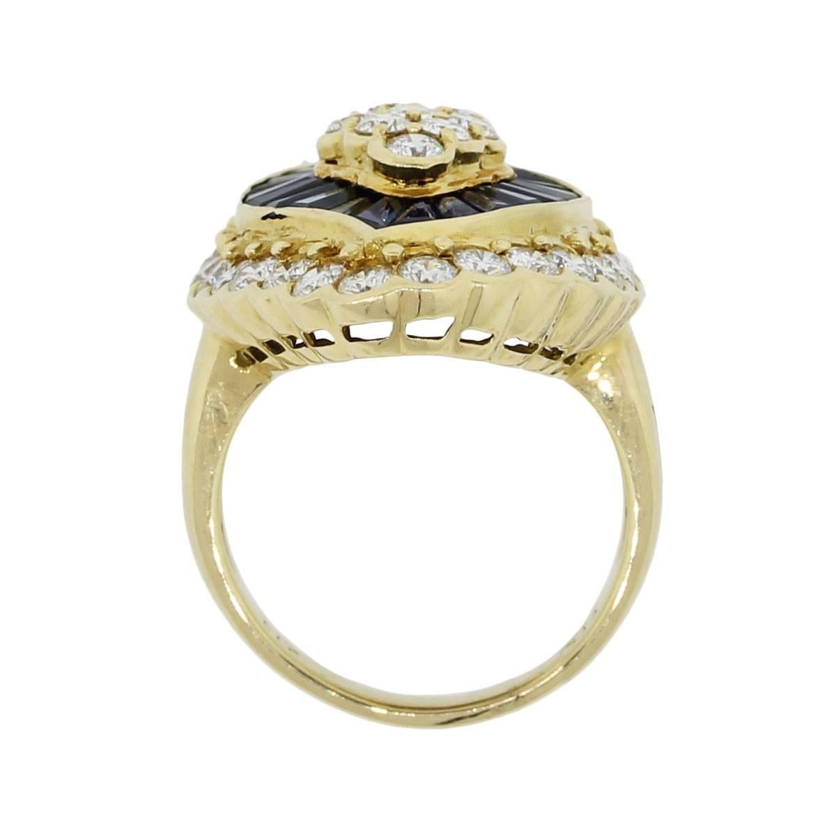 Material: 18k yellow gold
Diamond Details: Approximately 3.67ctw of round brilliant diamonds. Diamonds are G/H in color and SI in clarity.
Gemstone Details: Approximately 2.13ctw of baguette shape sapphires
Ring Measurements: 1.18″ x 1.12″ x