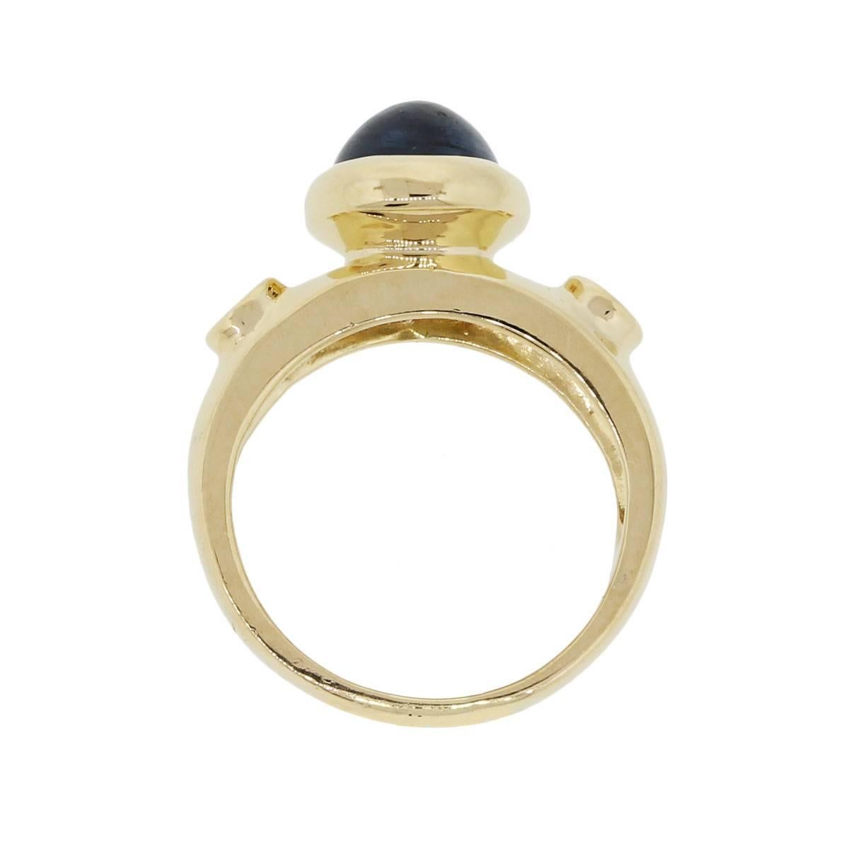 Material: 18k yellow gold
Diamond Details: Approximately 0.20ctw round brilliant diamonds. Diamonds are G/H in color and VS in clarity
Gemstone Details: Oval cabochon sapphire measuring approximately 9.16mm x 7.14mm
Ring Measurements: 1″ x 0.46″ x