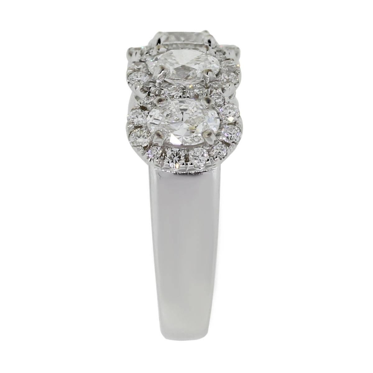 Material: 18k white gold
Diamond Details: Approximately 1.43ctw of oval shape diamonds and 0.48ctw of round brilliant diamonds. Diamonds are G/H in color and VS in clarity
Ring Size: 6
Ring Measurements: 0.87″ x 0.31″ x 0.85″
Total Weight: 5.6g