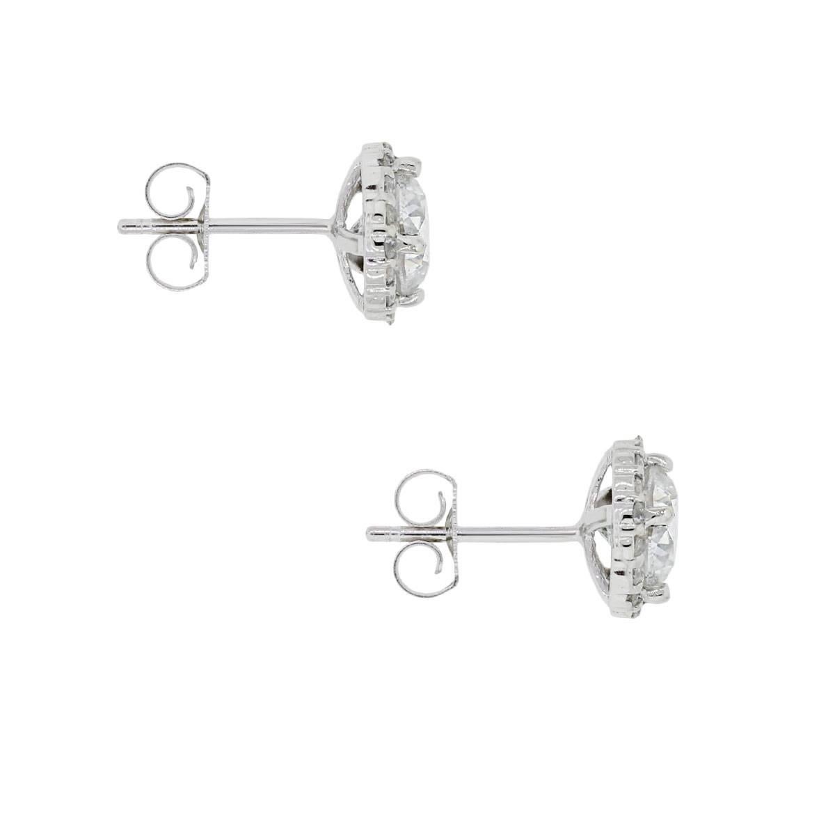 Material: 14k white gold
Diamond Details: Approximately 1.65ctw round brilliant center diamonds with 0.45ctw diamond halo. Diamonds are H in color and SI2 in clarity
Earring Measurements: 0.56″ x 0.32″ x 0.32″
Earring Backs: Post friction
Total