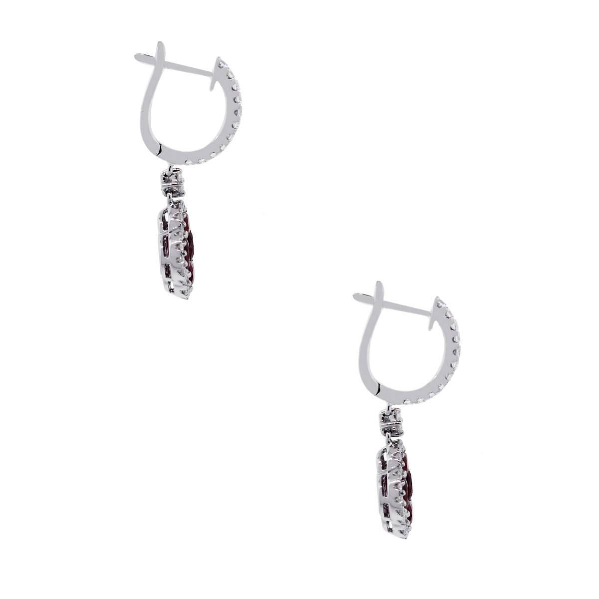Material: 18k white gold
Diamond Details: Approximately 0.54ctw round brilliant cut diamonds. Diamonds are G/H in color and VS in clarity.
Gemstone Details: Approximately 2.05ctw ruby gemstones.
Earring Measurements: 0.45″ x 0.20″ x 1″
Earring