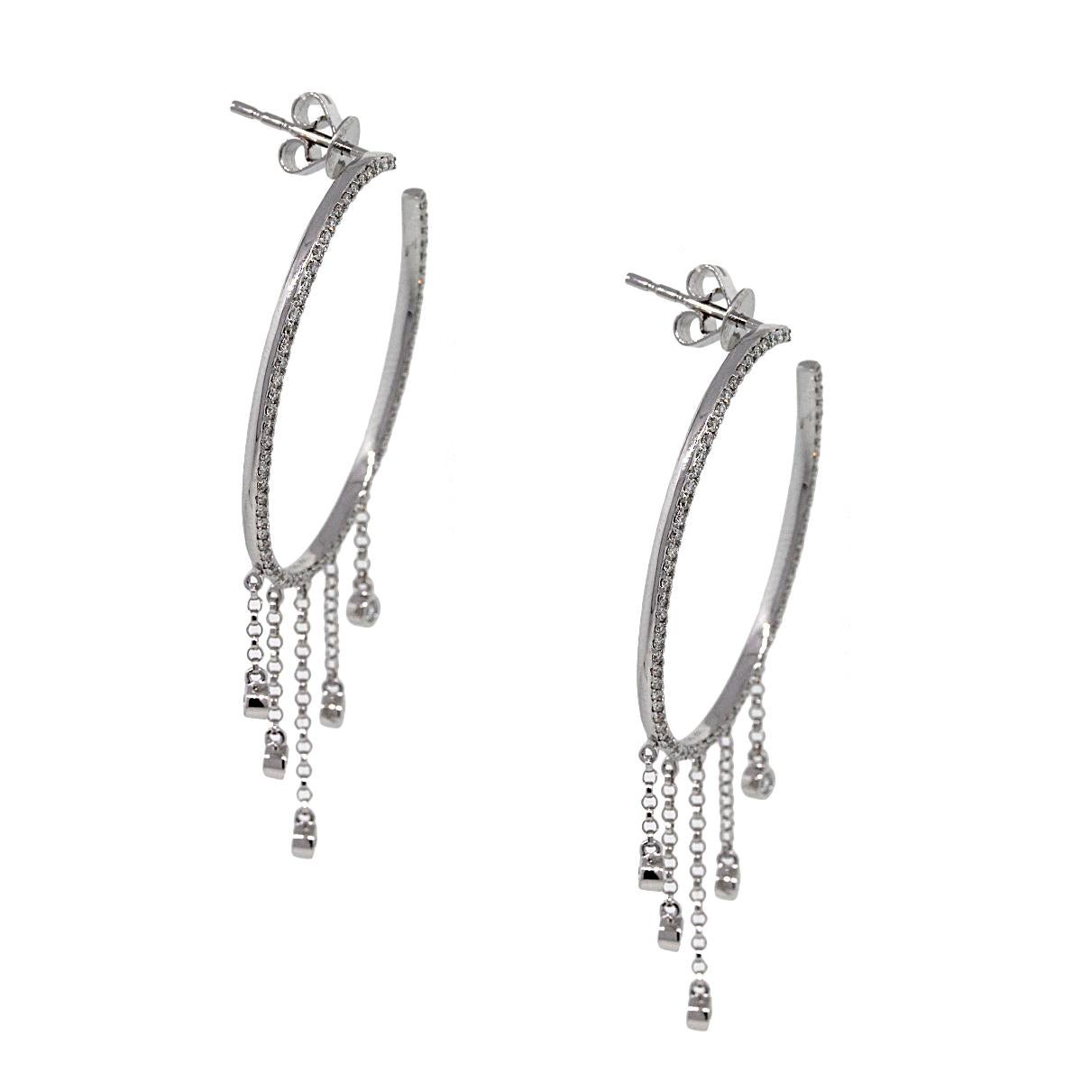 Material: 14k white gold
Style: Diamond Pave Oval Dangle Hoops
Diamond Details: Approximately 0.56ctw of round brilliant diamonds. Diamonds are G/H in color and SI in clarity.
Earring Measurements: 0.93″ x 0.50″ x 2″
Total Weight: 4.6g