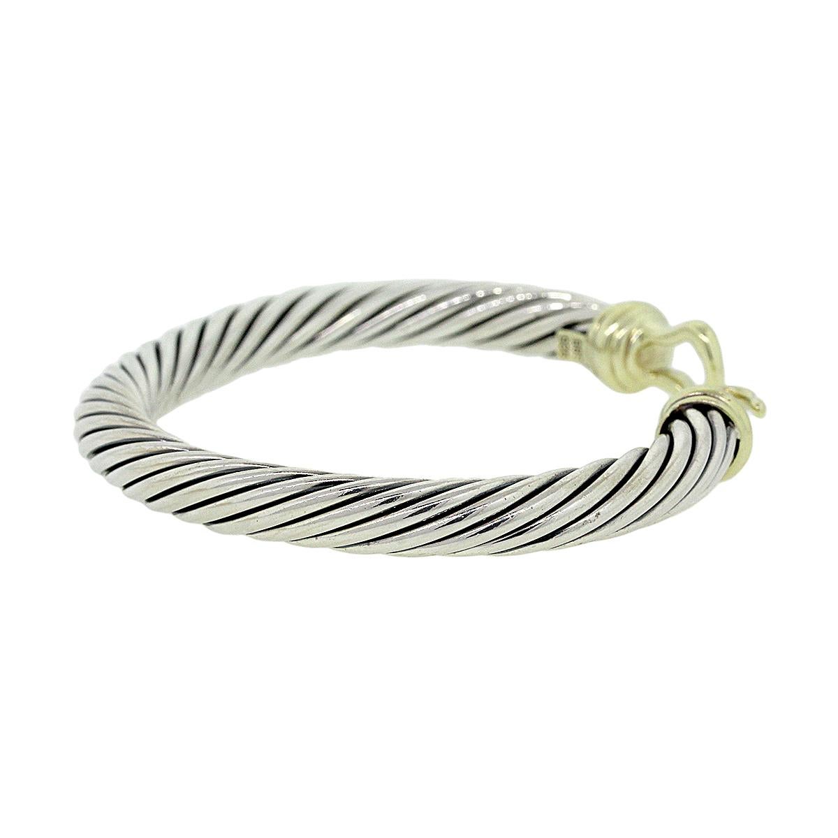 Designer: David Yurman
Material: Sterling silver and 14k yellow gold
Total Weight: 42.6g (27.4dwt)
Bracelet Measurements: Will fit a 6″ Wrist, 7mm in width
SKU: G8005