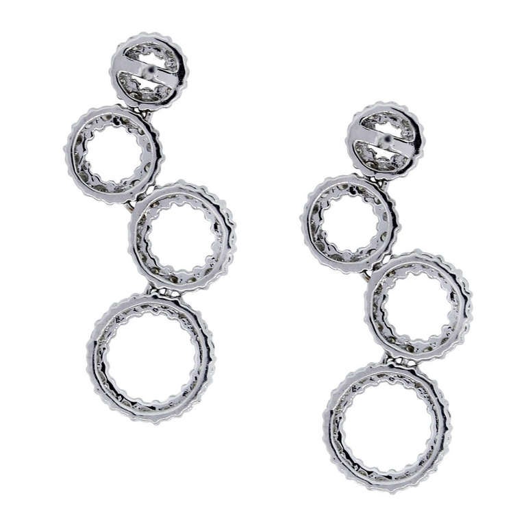 Style: 18k White Gold Diamond Multi-Circle Drop Dangle Earrings
Material: 18k White Gold
Measurements: 1 1/8'' Length and 0.40